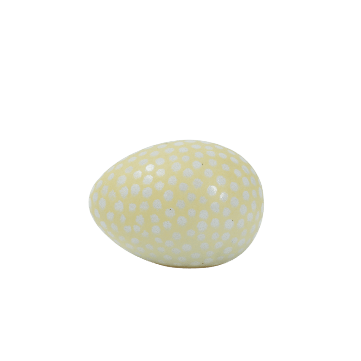 Ägg i keramik med smörgul färg som bas och vita handmålade prickar